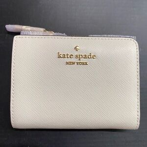 Brand New Beautiful Kate Spade Meringue Wallet with Gold Accents.
